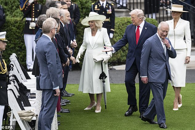 Trump (C) and King Charles III meet UK officials during a welcome ceremony