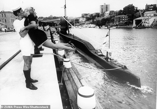 A submariner farewells his wife as HMS Trump prepares to leave Sydney, Australia, in 1969