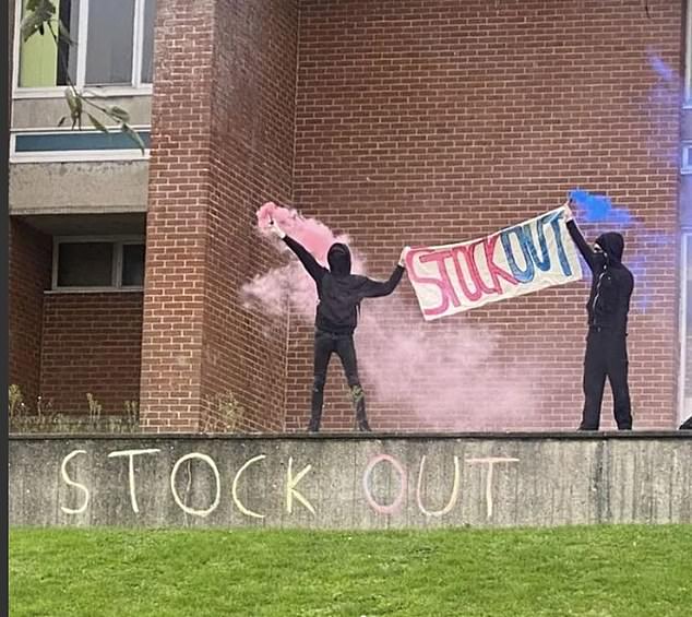 The High Court ruled today the Office for Students (OfS) watchdog had no power to impose the penalty following a landmark judicial review claim (pictured: trans activists at Sussex in 2021)
