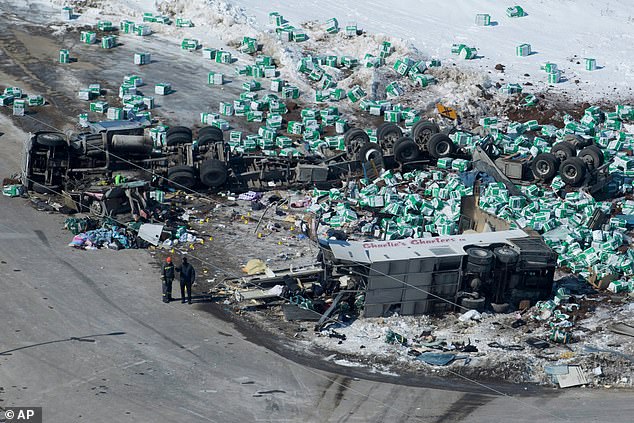 The hockey team's bus and the truck that crashed into it, as well as its scattered cargo, in the aftermath of the 2018 crash