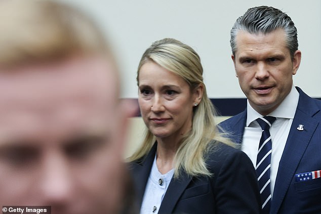US Secretary of Defense Pete Hegseth and his wife arrive for Hegseth's testimony before the House Armed Services Committee April 29, 2026 in the Rayburn House Office Building in Washington, DC