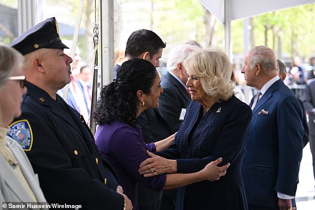 The King and Queen warmly greeted a string of officials at the site of the memorial