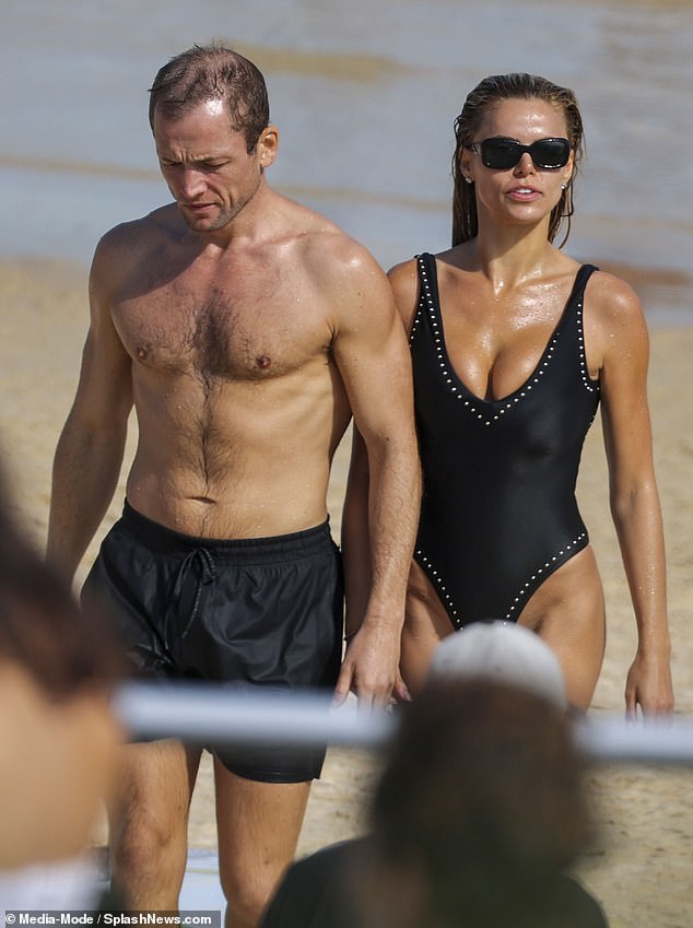 Taron was pictured walking out of the water in Bondi, Sydney, holding hands with Brooks, 29 - just like Daniel in his memorable Casino Royale beach scene