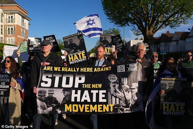 The held banners pleading with the Government to take action in a bid to stop antisemitism in the UK