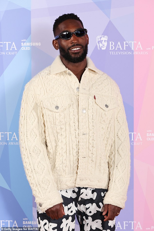 Tinie Tempah as cool as ever stopping for pictures as he arrives