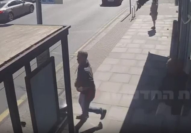 A man runs to help an elderly man who was stabbed by a bus stop by the Golders Green knifeman