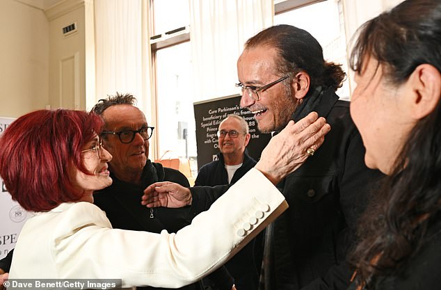Sharon appeared to be in good spirits as she mingled with the gathered crowd, posing for pictures with attendees