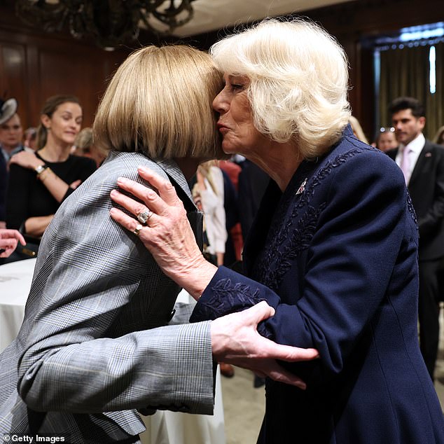 Queen Camilla greets Anna Wintour during a literary engagement at New York Public Library