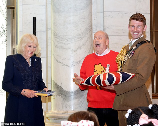 Camilla gifts the New York Public Library a specially-made replica of Roo alongside Jim Cummings during a visit to the New York Public Library