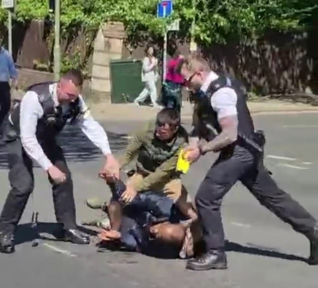 Officers tackled the knifeman along with a passerby, before arresting him