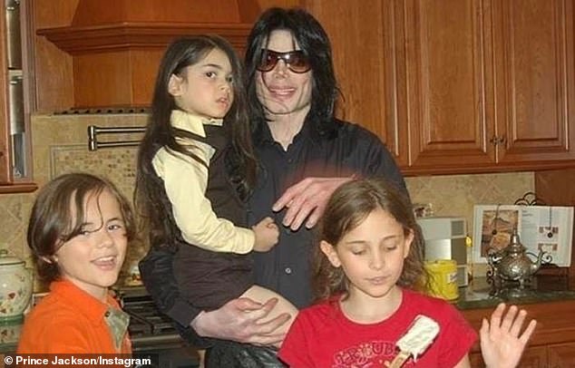 Describing Michael's parenting as 'awesome', Prince gushed that his notoriously reclusive dad was 'really fun to just spend time with'. Pictured: Prince (left), Paris (right) with Michael holding Bigi