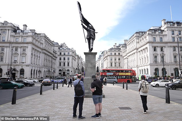 Commuters and passersby stopped to admire the statue, which appeared in the early hours of Wednesday morning