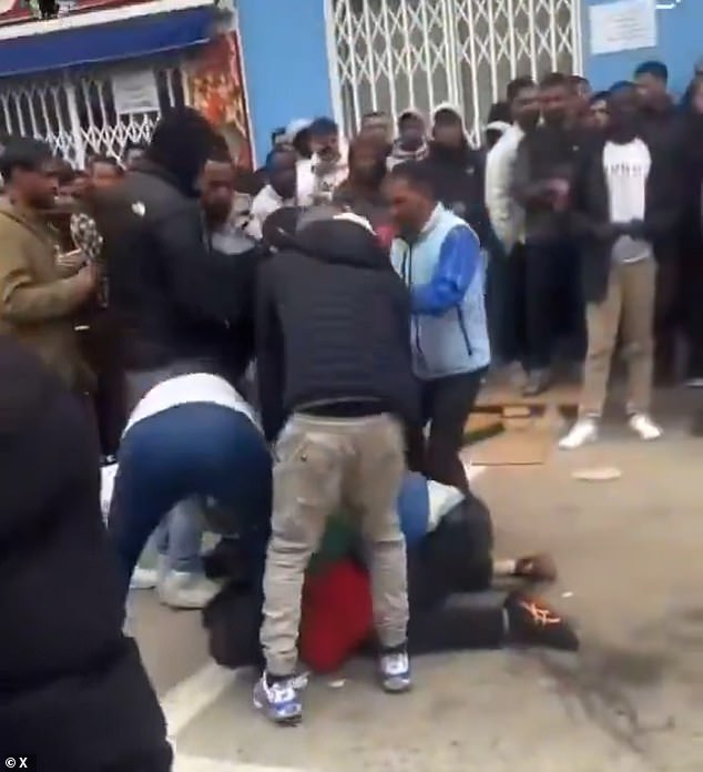 Video footage captured a chaotic brawl among a group of male migrants while hundreds looked on