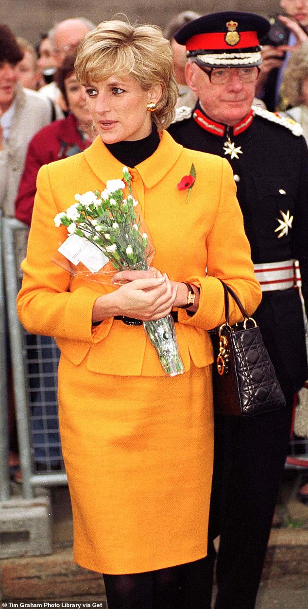 Pictured: Princess Diana is seen in Liverpool in 1995 wearing a Versace suit and carrying a Lady Dior bag