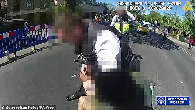 While one of the police officers managed to throw the knife away, another officer as well as the bystander gained control of the man's arms.