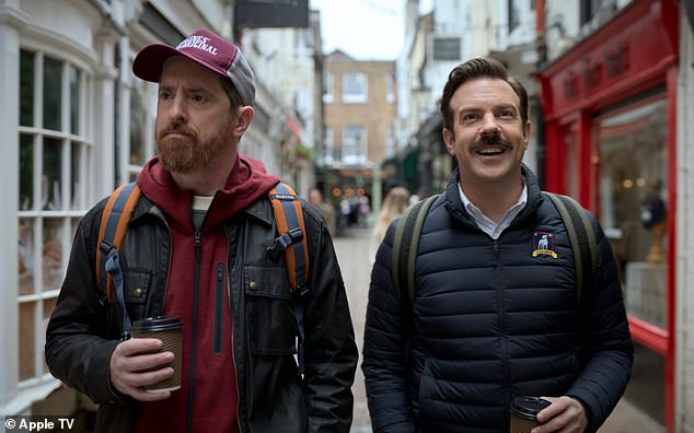 Ted effect: Paved Court, a once anonymous street close to Richmond green is now frequently filled with tourists since Apple TV+ show Ted Lasso began using it as a key location (Pictured: Brendan Hunt, left, Jason Sudeikis, right)