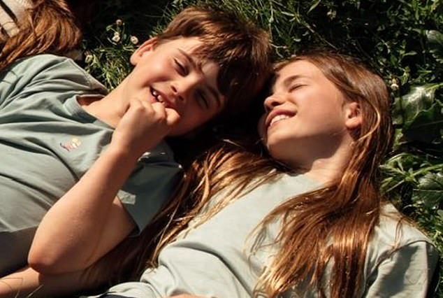 While William was wearing dark green, all the kids were matching in blue tops of varying shades