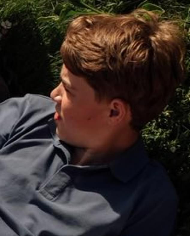 Eldest George was wearing a navy button up, while Charlotte matched her pastel blue manicure to her tee
