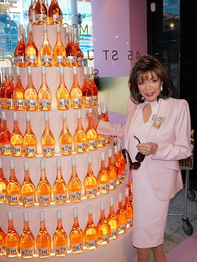 At the bash, Joan was seen standing beside a larger-than-life rosé tower, showcasing her favourite M&S Rosé La Balconne Organic Provence - during which she announced to rosé lovers that it was finally time to ¿begin sipping¿.