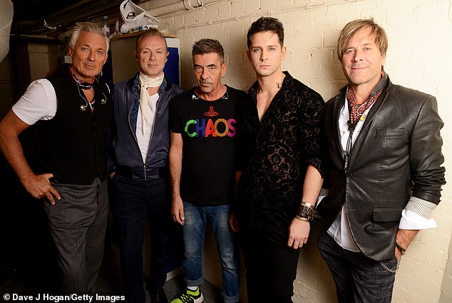 Davidson, who used the stage name Wild, is pictured with fellow Spandau Ballet band mates Martin Kemp, Gary Kemp, John Keeble and Steve Norman