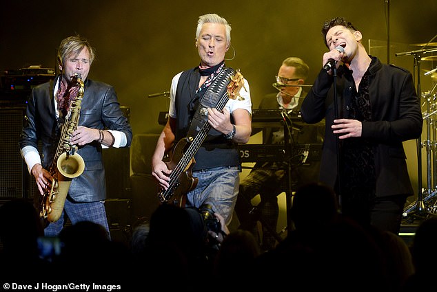 Davidson performs on stage alongside Steve Norman and Martin Kemp at Eventim Apollo on October 29, 2018