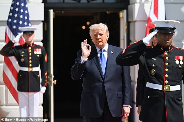 Mr Trump raises his hand in an 'OK' sign as Charles and Camilla depart the White House -- April 30, 2026
