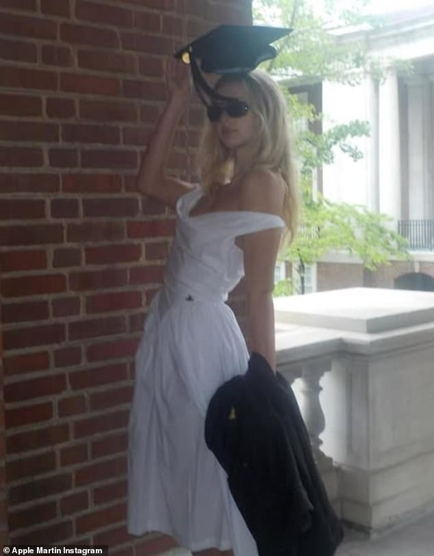 The 21-year-old wore a white dress with a black cap and gown as she prepares to graduate from Vanderbilt University in Nashville, Tennessee