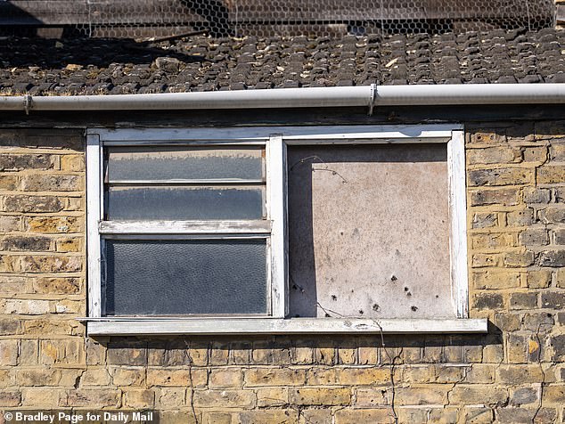 The windows of Mr Halbritter's south east London property are smashed in or bordered up