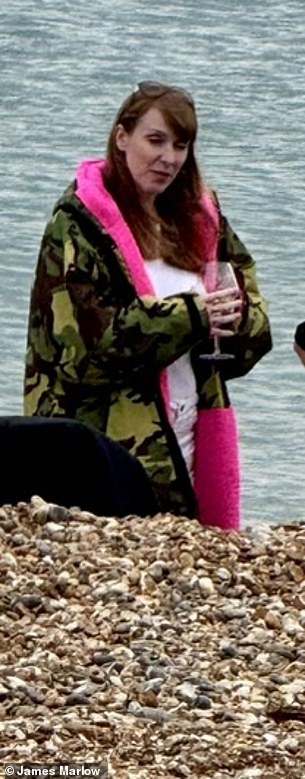 The then-Deputy Prime Minister enjoying rosé from a glass on Brighton beach