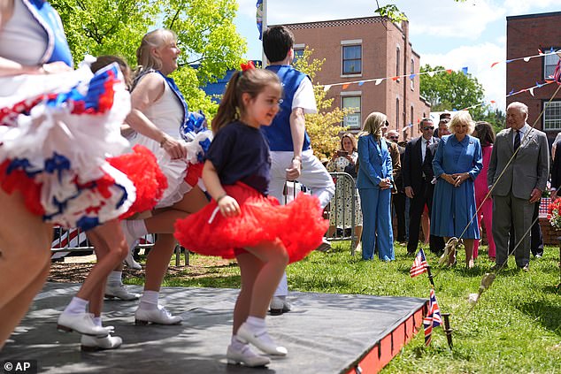 Charles and Camilla (right) attend a parade and block party event on the final day of their state visit