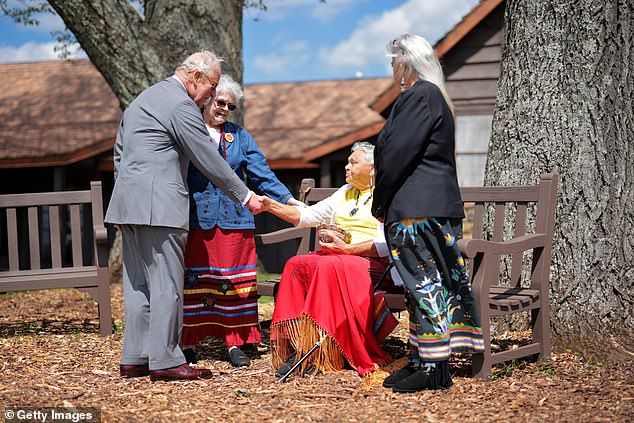 King Charles III speaks with members of the Monacan Indian Nation during a visit at Dickey Ridge Visitor Center at Shenandoah National Park