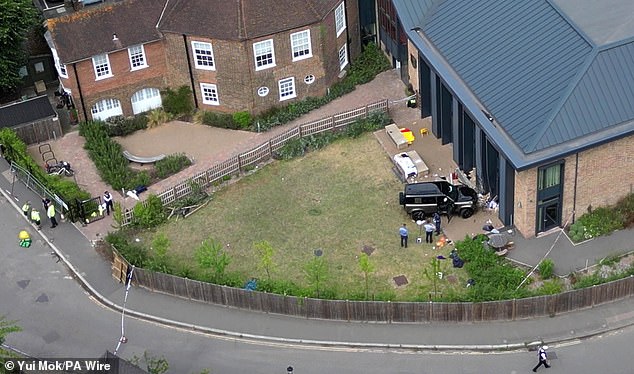 The Land Rover Defender inside the grounds of The Study Preparatory School in Camp Road, Wimbledon, south London
