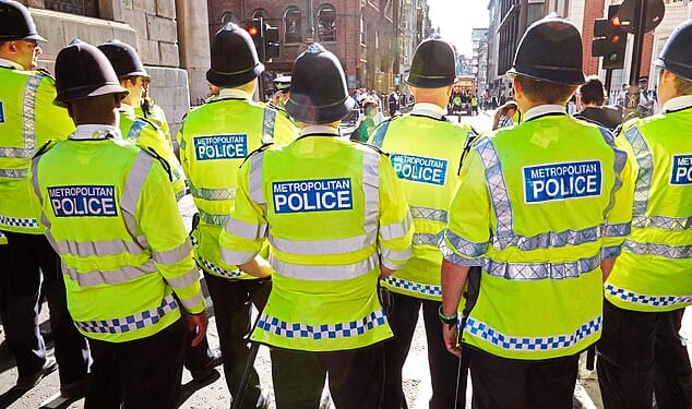 In an unprecedented crackdown, Britain's biggest force secretly unleashed an AI tool to root out bad behaviour. Pictured: Metropolitan Police officers on duty (file photo)