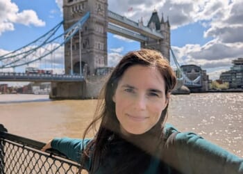 Amanda Knox, 38, smiles as she poses near Tower Bridge just miles from tragic Meredith’s family home