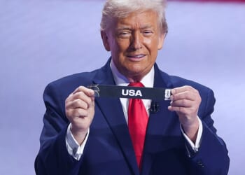 Shop window: 78 matches will take place across 11 US cities when the World Cup kicks off this summer but tourism figures to America are down (President Trump pictured after drawing the US during the FIFA World Cup 2026 Official Draw in December)