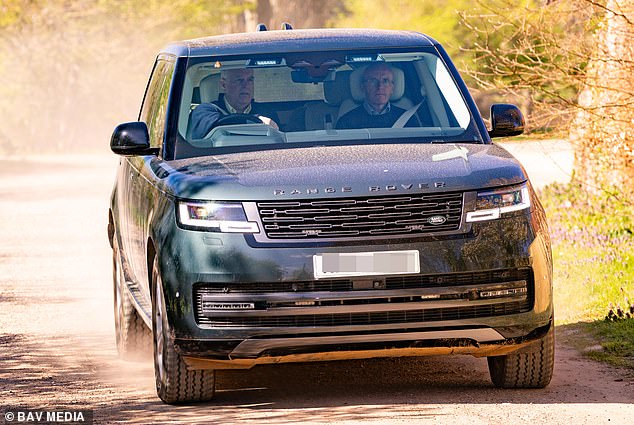 The disgraced royal looks solemn as he makes his way down a country track today
