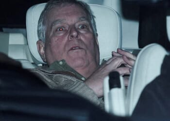 Andrew Mountbatten Windsor pictured leaving a police station following his arrest on suspicion of misconduct in public office in February