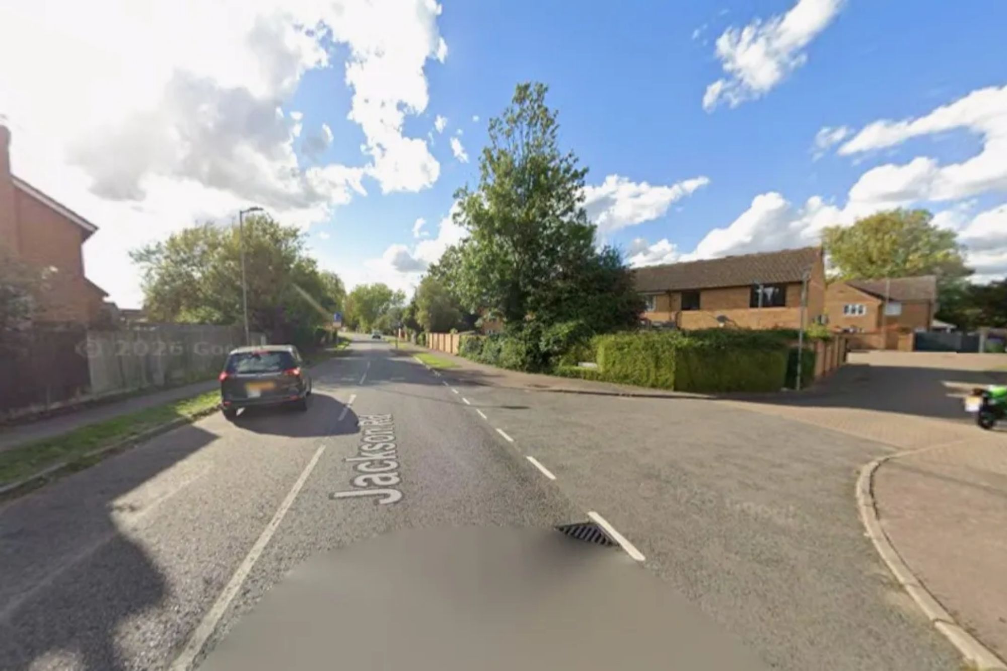 An image collage containing 1 images, Image 1 shows Jackson Road in Aylesbury with a parked car and houses