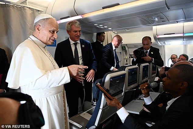 Pope Leo XIV speaks to journalists aboard a flight on his way to Luanda, Angola. The Pope faced scathing criticism from US President Donald Trump , who earlier this month branded the religious leader 'weak on crime'