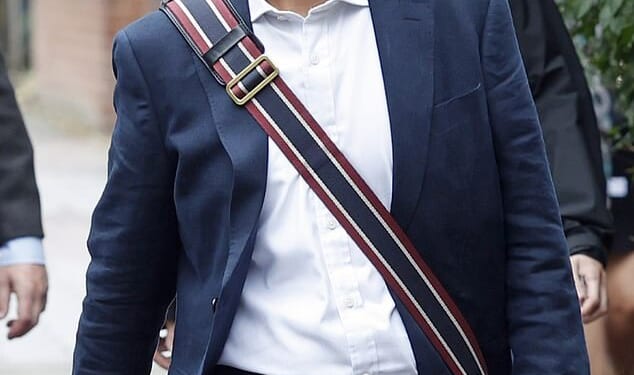 Five officers are believed to have mistakenly abandoned the bag outside the property belonging to the Labour mayor (pictured walking near his home) in Clapham, south London, at around 9.30pm on Tuesday