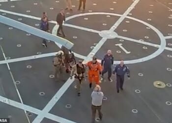 All four members of the Artemis II crew were supported by a person on each side, while a third assistant pushed a wheelchair behind them in case it was needed, after arriving back from their moon mission