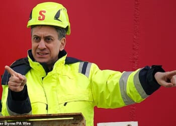 Research conducted by former Conservative deputy chairman Lord Ashcroft has found that half of all voters think Mr Miliband should 'drill, baby, drill'. Pictured: Mr Miliband on a visit to the Port of Holyhead, North Wales in 2024