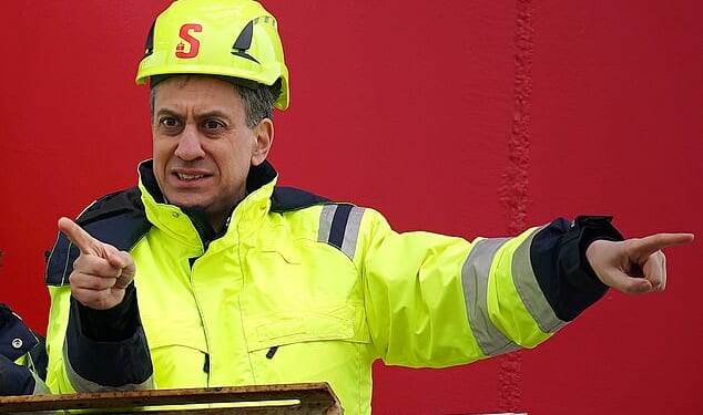 Research conducted by former Conservative deputy chairman Lord Ashcroft has found that half of all voters think Mr Miliband should 'drill, baby, drill'. Pictured: Mr Miliband on a visit to the Port of Holyhead, North Wales in 2024