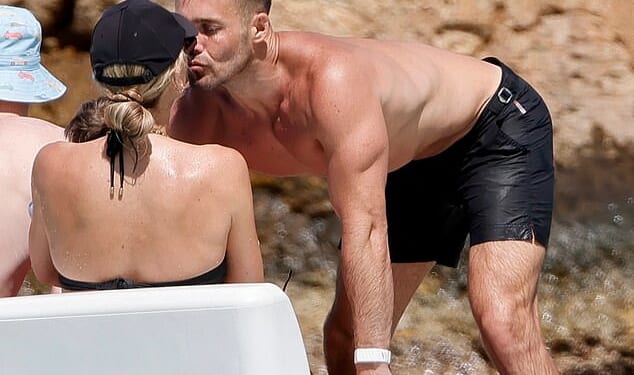 Vogue Williams and Spencer Matthews appeared more loved-up than ever as they packed on the PDA amid their lavish family getaway to St Barts on Friday