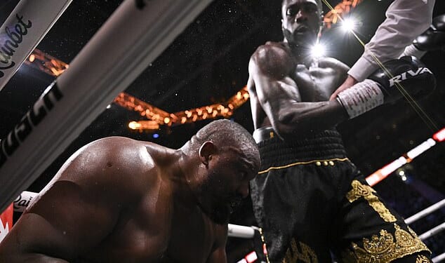 Deontay Wilder sends Derek Chisora to the floor - after telling him 'I'm sorry, I love you'