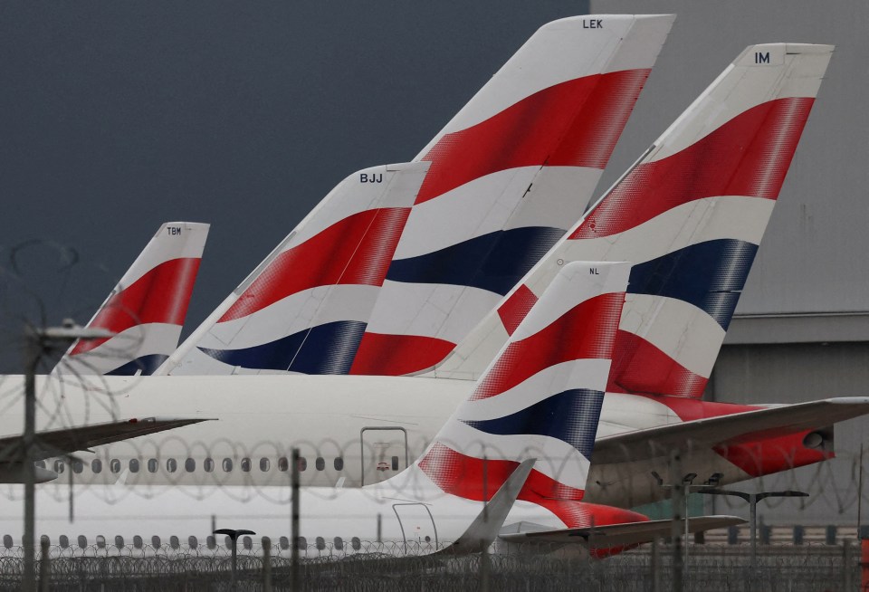 The livery of British Airways passenger planes are seen at Heathrow Airport in West London.