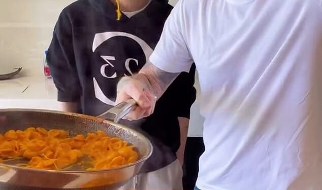 Brooklyn Beckham is mocked in his latest cookery video for 'boiling some pasta' as fans notice he's hanging on to his favourite £220k watch gifted by dad David