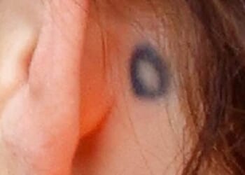 One of the few royals with a tattoo, she debuted a small circle design behind her ear in 2022