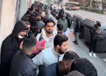 Massive queues of migrants have been forming at registry offices in Spain