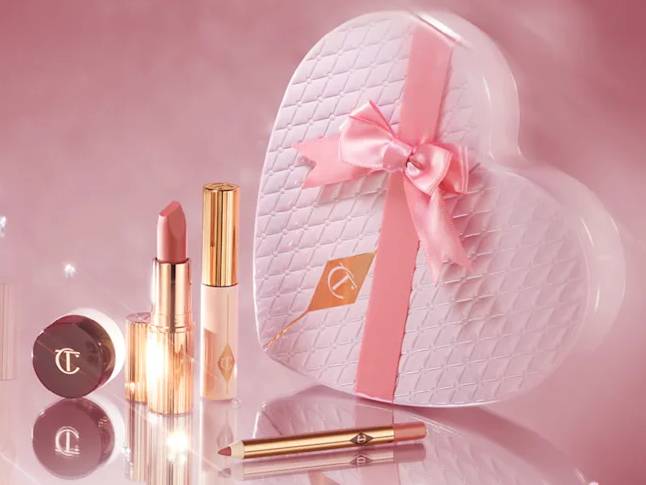 Charlotte Tilbury Pillow Talk makeup set, including lipstick, lip liner, and eyeshadow, with a heart-shaped gift box.